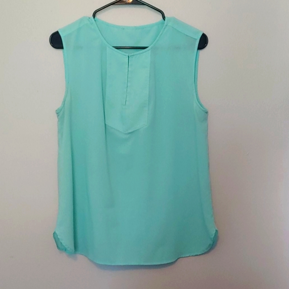 Mint green sleeveless blouse fits like a large
